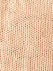 Organic knitted background with macro weave threads.
