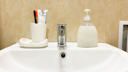 personal hygiene items on a white sink