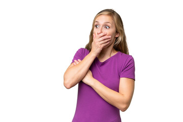 Young blonde woman over isolated background doing surprise gesture while looking to the side