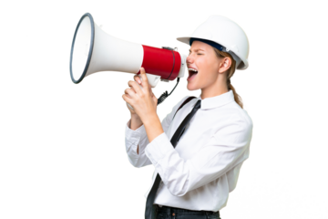 Young architect caucasian woman with helmet and holding blueprints over isolated background shouting through a megaphone