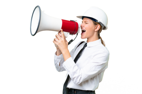 Young architect caucasian woman with helmet and holding blueprints over isolated background shouting through a megaphone