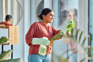 Woman, cleaning and window st home for dirt, dust and bacteria with a cloth and spray bottle for...