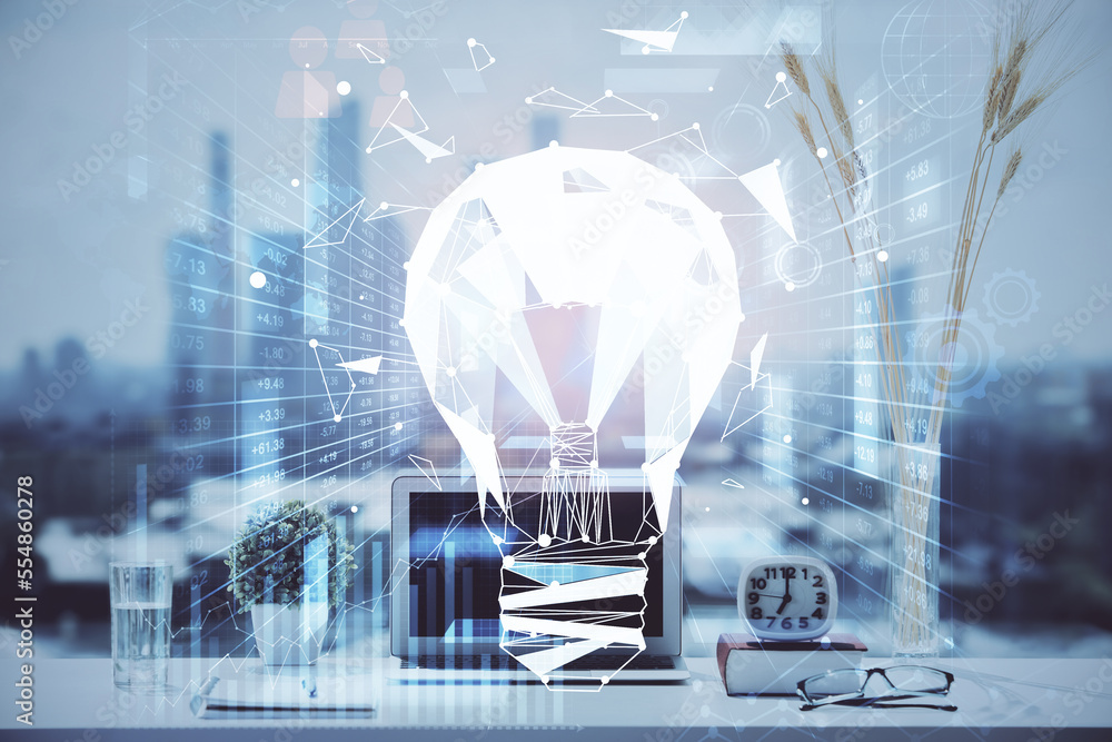 Poster Computer on desktop in office with bulb icon hologram. Double exposure. Concept of idea.