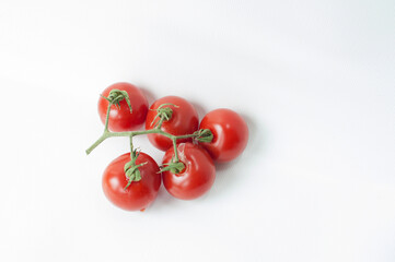 Red cherry tomatoes on a white background isolated on a white background