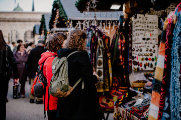 People visiting the Christmas market in Vienna.