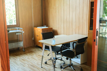 Medical professional workspace with table and first aid equipment in room. medicine and healthcare concept
