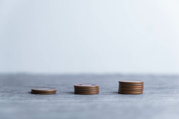 stack of silver coins with trading chart in financial concepts and financial investment business stock growth