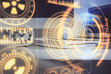 Computer on desktop in office with technology theme hologram. Multi exposure. Tech concept.