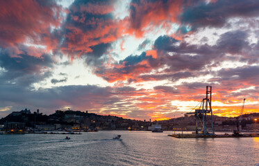 Naklejka premium the harbor entrance and old town of Ancona on the Adriatic Sea at sunrise