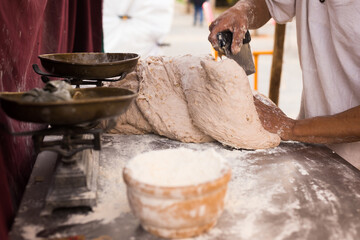 male hands knead yeast dough for baking bread