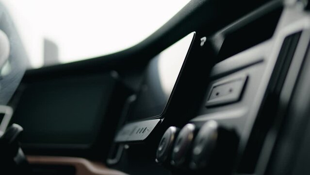driver peeling plastic screen protector of a freightliner cascadia volvo 2023. Cinematic shallow depth of field.