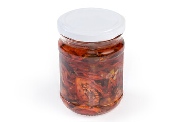 Jar of sun-dried tomatoes in vegetable oil with spices