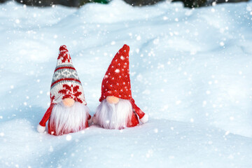 Christmas holiday card Cute scandinavian gnomes with red hat and white beard on snowy winter bench Fairytale snowfall Wintertime Hello December, January, February concept Happy New Year, Christmas