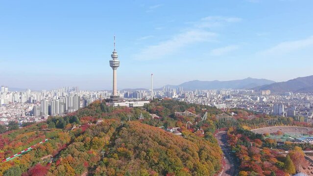 Daegu: Aerial view of Metropolitan City in South Korea, Duryu Park in autumn colors, sunny day - landscape panorama of Eastern Asia from above