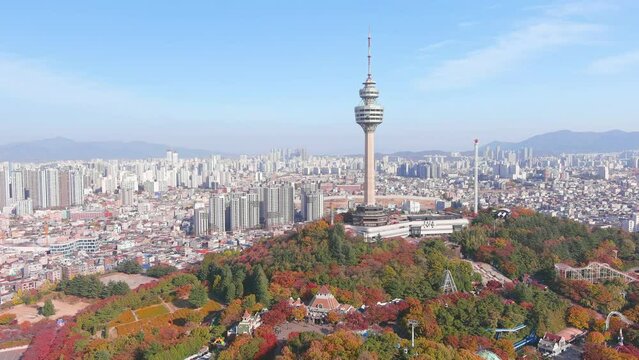 Daegu: Aerial view of Metropolitan City in South Korea, Duryu Park in autumn colors, sunny day - landscape panorama of Eastern Asia from above