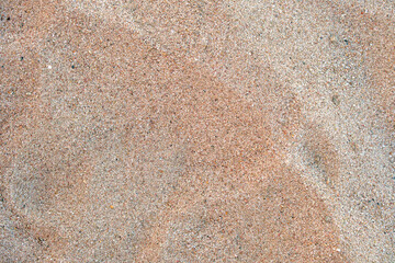 Flat view of clean yellow sand surface covering seaside beach. Sandy texture