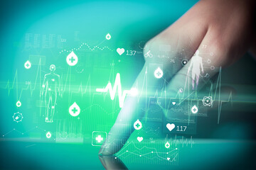 Close-up of a touchscreen with healthcare icons