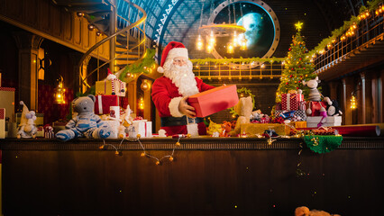 Jolly Santa Claus in His Studio Workshop: Wrapping and Packing Christmas Gifts for all the Good Children to be Delivered on the Magical New Year Eve. He Prepares the Gifts this Winter Holiday