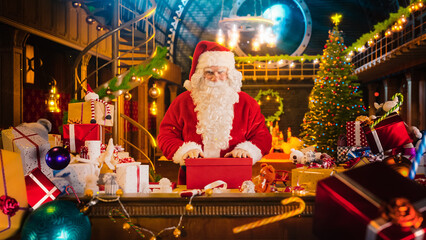 Santa Claus in Studio Workshop: Wrapping Christmas Gifts for all the Good Children to be Delivered...