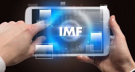 Close-up of a hand holding tablet