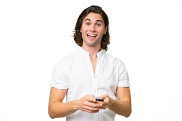 Young caucasian man isolated on green chroma background surprised and sending a message