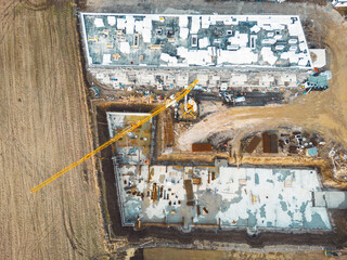 Top down view construction site of two residential buildings in progress 