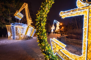 Christmas illuminations by the pier in Brzezno at dusk, Gdansk.  Poland.