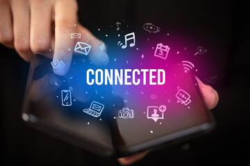 Businessman holding a foldable smartphone, social media concept