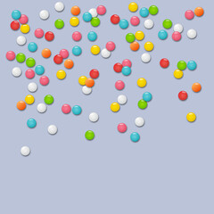 Colourful round candies on grey background