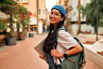 Fototapeta Asian female tourist student on city streets obraz