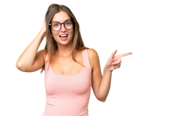 Young pretty woman over isolated background surprised and pointing finger to the side