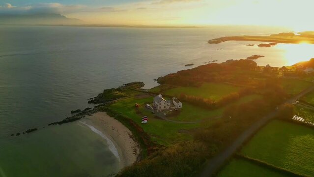 Sun set on the Irish coast with a view of the Lough Foyle river.