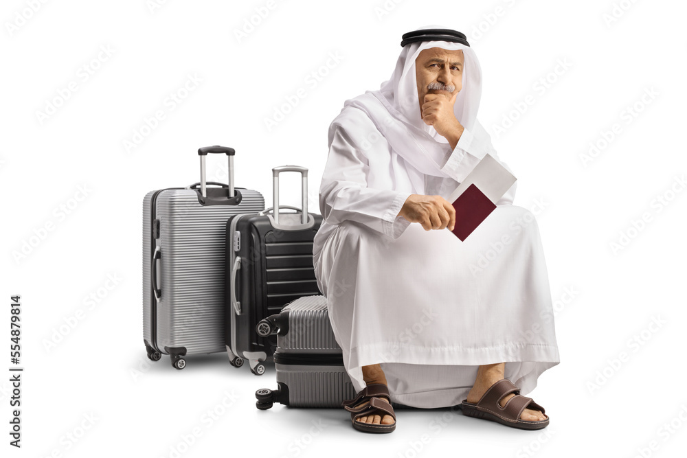 Sticker Arab man sitting on a suitcase holding a passport and waiting for a flight