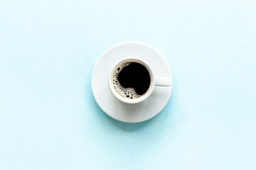 Black coffee - espresso - in white cup. Morning routine concept