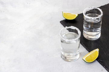 Strong alcohol background - glasses of tequila with salt