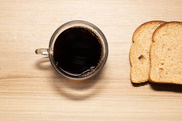 Breakfast with wholemeal bread on wooden table