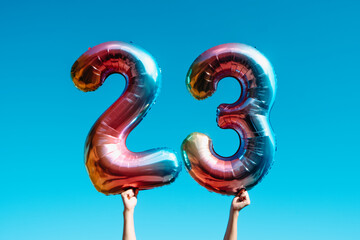 showing two balloons forming the number 23