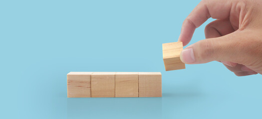 Wooden cubes in hand with copy space for input wording