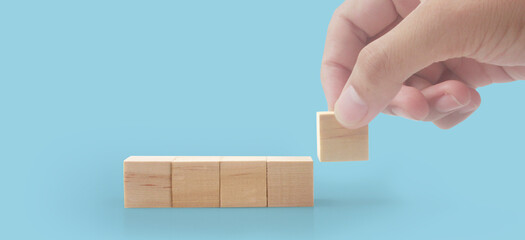 Wooden cubes in hand with copy space for input wording
