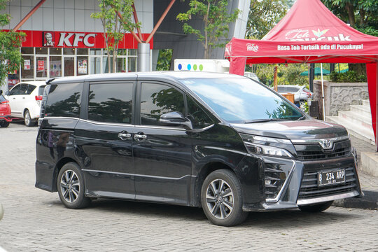 Semarang - March, 2023 : The Toyota Noah or Voxy is a minivan with two rear sliding doors built by Toyota and sold mainly in Asian countries. It is positioned below the Estima and Alphard.