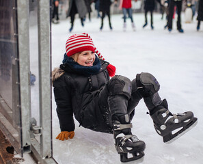 Boy skating on a rink at the Christmas market