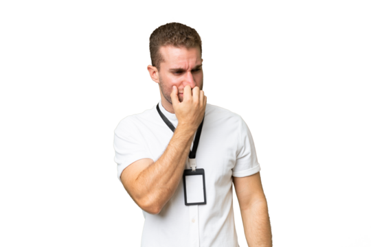 Young caucasian man with ID card isolated on green chroma background having doubts