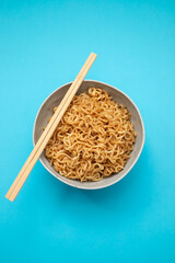 Fresh tasty noodles with vegetables in white bowl