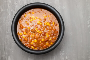 Mexican typical dish Chili Con Carne on black dish