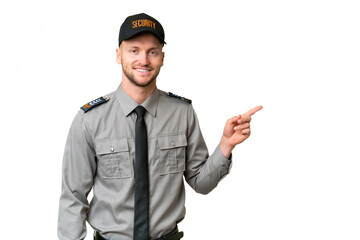 Young security caucasian man over isolated background pointing finger to the side