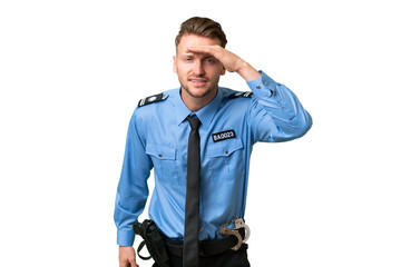 Young police man over isolated background looking far away with hand to look something