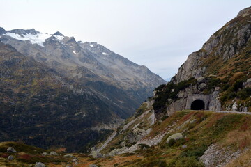 Fototapeta na wymiar Snowy peaks, glacier and lake on San Gotthard Pass
