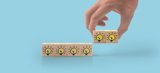 Wooden cubes in hand with copy space for input wording