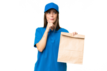 Young beautiful caucasian woman taking a bag of takeaway food over isolated background having doubts and thinking