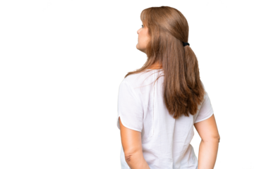 Middle-aged caucasian woman over isolated background in back position and looking back